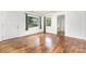 Hardwood floors, white walls, and natural light make this living room a cozy, relaxing space at 2819 Georgia Ave, Charlotte, NC 28205