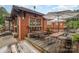 This image showcases an inviting outdoor seating area featuring wooden picnic tables and a shaded canopy, perfect for dining at 2819 Georgia Ave, Charlotte, NC 28205