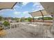 Spacious rooftop patio with numerous tables and chairs, ideal for outdoor dining and enjoying scenic views at 2819 Georgia Ave, Charlotte, NC 28205