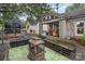 Charming storefront with a cozy porch and decorative benches offers a warm welcome to visitors at 2819 Georgia Ave, Charlotte, NC 28205