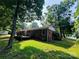 Brick home with a deck overlooking a spacious, tree-filled backyard at 316 Meadowood Cir, Kannapolis, NC 28081