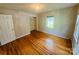 Bedroom featuring wood floors, a window and a closet with built-ins at 316 Meadowood Cir, Kannapolis, NC 28081