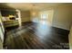 Open-concept living space with wood floors and neutral wall colors at 316 Meadowood Cir, Kannapolis, NC 28081