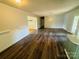 Open-concept living room with wood floors and neutral color scheme at 316 Meadowood Cir, Kannapolis, NC 28081