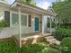 Inviting covered porch with a bright blue door, offering a warm welcome to the home at 3339 Benard Ave, Charlotte, NC 28206