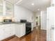 Efficient kitchen featuring classic white cabinetry, a gas range, and a view of adjoining rooms at 3339 Benard Ave, Charlotte, NC 28206