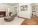 Open living space with hardwood floors, fireplace, and views into adjacent rooms at 3339 Benard Ave, Charlotte, NC 28206