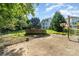 Expansive backyard featuring an above-ground pool, a basketball hoop, and a sports net, perfect for outdoor activities at 3505 Mallard Cove Ct, Charlotte, NC 28269
