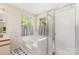 Bright bathroom with separate shower, large tub and an abundance of natural light at 3505 Mallard Cove Ct, Charlotte, NC 28269