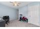 Cozy bedroom with light blue walls and a ceiling fan at 3505 Mallard Cove Ct, Charlotte, NC 28269