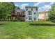 Exterior of a home with a large backyard, deck, mature trees, and a two-story design at 3505 Mallard Cove Ct, Charlotte, NC 28269