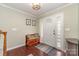 Inviting foyer with hardwood floors, a bench, and natural light from the front door at 3505 Mallard Cove Ct, Charlotte, NC 28269