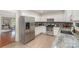 Updated kitchen features gray granite countertops, stainless appliances, and gray subway tile backsplash at 3505 Mallard Cove Ct, Charlotte, NC 28269
