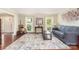 Bright living room with hardwood floors, natural light, and a comfortable seating area at 3505 Mallard Cove Ct, Charlotte, NC 28269