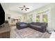 Open-concept living room featuring a view into kitchen and access to outdoor patio at 3505 Mallard Cove Ct, Charlotte, NC 28269