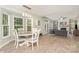 An open concept eat-in area flows to a living room with a fireplace and lots of natural light at 3505 Mallard Cove Ct, Charlotte, NC 28269