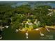 Lakefront property with private docks surrounded by lush greenery, captured from an aerial perspective at 3735 Gordon St, Terrell, NC 28682