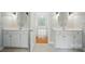 Elegant bathroom with dual vanities and sinks, leading to a view of the bedroom and natural light at 3735 Gordon St, Terrell, NC 28682