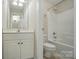 Compact bathroom with a single vanity, a toilet, and a shower-tub combo with white tile at 3735 Gordon St, Terrell, NC 28682