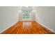 Bright bedroom with hardwood floors and a large window offering plenty of natural light at 3735 Gordon St, Terrell, NC 28682