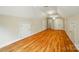 Large bonus room featuring hardwood floors, a ceiling fan, and multiple entry doors at 3735 Gordon St, Terrell, NC 28682