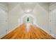 Spacious bonus room with beautiful hardwood floors, white walls, and natural light from a window at 3735 Gordon St, Terrell, NC 28682