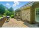 Wooden deck with barbecue grill overlooking the backyard with brick exterior at 3735 Gordon St, Terrell, NC 28682