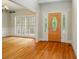 Welcoming foyer with hardwood floors, large windows, and a decorative front door at 3735 Gordon St, Terrell, NC 28682