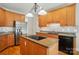 Kitchen with an island cooktop, granite countertops, and stainless steel appliances at 3735 Gordon St, Terrell, NC 28682