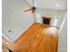 Bright living room featuring hardwood floors, a fireplace, and a ceiling fan with natural light at 3735 Gordon St, Terrell, NC 28682