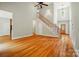 Open-concept living area with high ceilings, hardwood floors, and a staircase at 3735 Gordon St, Terrell, NC 28682