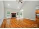 Bright living room featuring hardwood floors, a fireplace, and large windows at 3735 Gordon St, Terrell, NC 28682