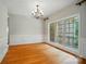 Spacious living room featuring large windows offering natural light, complemented by hardwood floors and trim at 3735 Gordon St, Terrell, NC 28682
