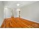 Spacious main bedroom featuring hardwood floors, tray ceiling, ceiling fan, and lots of natural light at 3735 Gordon St, Terrell, NC 28682