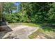 This backyard features a patio and green landscaping at 3939 Sheffield Dr, Charlotte, NC 28205