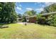 This backyard features a patio, lush landscaping and a well-maintained lawn at 3939 Sheffield Dr, Charlotte, NC 28205