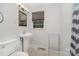 This bathroom features a vanity sink with a gray accent wall at 3939 Sheffield Dr, Charlotte, NC 28205
