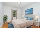 This staged bedroom offers hardwood floors, a window, and neutral walls at 3939 Sheffield Dr, Charlotte, NC 28205