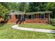 Classic brick home with a neat front yard and inviting front entrance at 3939 Sheffield Dr, Charlotte, NC 28205