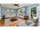 Bright living room with hardwood floors, neutral decor, and large windows at 3939 Sheffield Dr, Charlotte, NC 28205