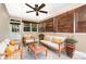 Cozy sunroom with tile floors, neutral walls, and natural light streaming in from windows at 3939 Sheffield Dr, Charlotte, NC 28205