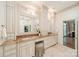 Luxurious bathroom with double vanities, marble countertops, and custom cabinets at 4001 Doves Roost Ct, Charlotte, NC 28211