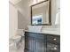 Contemporary bathroom featuring a vessel sink, elegant vanity, and sleek fixtures at 4001 Doves Roost Ct, Charlotte, NC 28211