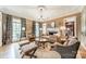 Cozy living room with a fireplace, neutral tones, and ample seating for entertaining guests at 4001 Doves Roost Ct, Charlotte, NC 28211