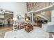 Spacious living room with soaring ceilings, grand staircase, hardwood floors, and decorative chandelier at 4001 Doves Roost Ct, Charlotte, NC 28211