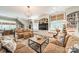 Inviting living room with custom built-ins, large windows, and comfortable seating arrangements at 4001 Doves Roost Ct, Charlotte, NC 28211