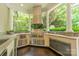 Well-equipped outdoor kitchen with built-in grill, stainless steel appliances, and countertop space for food preparation at 4001 Doves Roost Ct, Charlotte, NC 28211