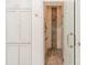 Stylish bathroom with glass enclosed shower, tiled walls, and built-in shelves at 4001 Doves Roost Ct, Charlotte, NC 28211