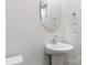 Bathroom featuring a pedestal sink and oval mirror at 422 Nixon Rd, Belmont, NC 28012