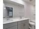 Bathroom features a double sink vanity with gray cabinets and shower-tub at 422 Nixon Rd, Belmont, NC 28012